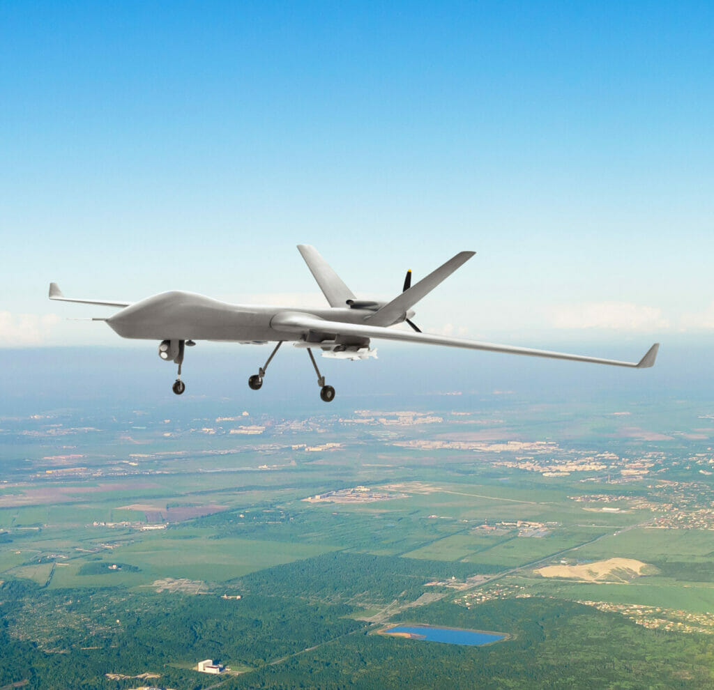 Unmanned military drone uav on patrol air territory at low altitude.