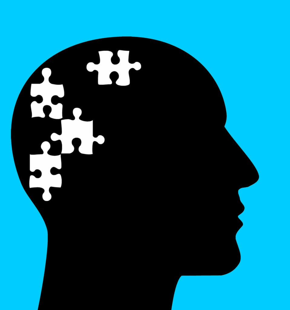 shadow portrait with puzzle pieces missing from brain